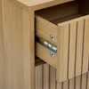 A close-up view of an open drawer in a wooden cabinet. Podgląd zdjęcia produktu