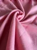 A close-up shot of pink fleece fabric, showing its texture and folds. Produktbild-Vorschau