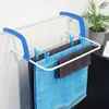 A laundry rack is attached to a radiator, drying towels. Náhled obrázku produktu