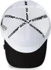 The inside of a white trucker cap with a black brim, showing the internal branding and structure. Produktbild-Vorschau