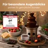 A chocolate fountain is set up on a wooden table with strawberries, waffles, and chocolate bars, suggesting a cozy gathering or party. Podgląd zdjęcia produktu