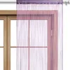 A string curtain hanging in front of a wooden window frame. Náhľad obrázku produktu