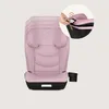 A pink child car seat with a black base and a cup holder, shown from the front. A circular inset shows a hand adjusting the headrest. Náhled obrázku produktu