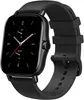 A black smartwatch with a black strap is shown against a white background. Voir les images du produit