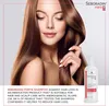 A woman with long brown hair is shown, holding her hair, with a bottle of Seboradin Forte Shampoo in the foreground. Podgląd zdjęcia produktu
