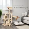 A cat tree with multiple levels and scratching posts, set up in a living room with a sofa and a plant. Several cats are interacting with the cat tree and a pillow. Náhled obrázku produktu
