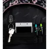 Close-up view of the interior of a backpack, showing a phone, keys, and pens. Produktbild-Vorschau