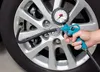A hand is using a tire pressure gauge to check the air pressure in a car tire. Náhľad obrázku produktu