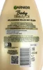 The back of a Garnier Body Beauty Oil lotion bottle, showing product information and a barcode. Produktbild-Vorschau