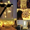 A collage of images showing star-shaped string lights used for decoration in various settings, including a bedroom, a room with photos, and a festive Christmas tree. Náhled obrázku produktu