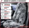 A close-up of a gray sheepskin car seat cover draped over a car seat, with a snowy mountain landscape visible through the car window in the background. Text boxes on the left list the benefits of sheepskin. Produktbild-Vorschau