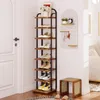 A tall, narrow shoe rack filled with shoes, placed next to a white door, with a small stool and a wall organizer in the background. Produktbild-Vorschau