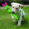 A puppy running on grass with a toy in its mouth. Anteprima dell’immagine prodotto
