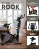 A marketing image of an exercise bike with feature callouts. Produktbild-Vorschau