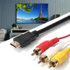 A close-up of an HDMI to RCA adapter cable with a TV in the background displaying a scenic view. Voir les images du produit