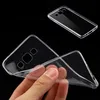 A transparent phone case is being held by a hand against a black background. Another phone case is visible in the top right corner. Produktbild-Vorschau