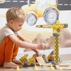 A young boy playing with a construction toy set. Voir les images du produit
