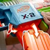 A close-up shot of a Nerf gun with a hand inserting a magazine. Produktbild-Vorschau