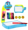 A set of children's drawing projector toys, including a projector, drawing board, markers, and projection discs, arranged on a white background. Náhled obrázku produktu