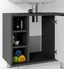A close-up view of an open sink cabinet with shelves and towels. Produktbild-Vorschau