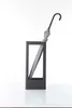 A modern, minimalist umbrella stand with an umbrella inside, set against a white background. Produktbild-Vorschau