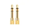 Two gold audio adapters on a white background. Podgląd zdjęcia produktu