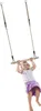 A young girl is swinging on a wooden trapeze bar suspended by ropes. Anteprima dell’immagine prodotto