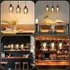 A collage of four images showing pendant lights in different settings, including a dining room, a bar, and a cafe. Produktbild-Vorschau