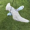 A plastic bird decoy is hanging in a grassy yard. Náhled obrázku produktu