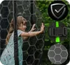 A young girl is playing inside a trampoline net, with close-up shots of the net material and a buckle. Produktbild-Vorschau