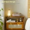 A bedside table with a lamp, a digital clock, and decorative items on a shelf. Náhled obrázku produktu