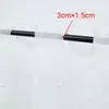 A close-up view of a white sheer curtain with a scalloped edge, hanging on a black rod. A red arrow points to a section of the curtain with text indicating dimensions. Produktbild-Vorschau