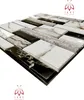 A close-up, angled view of a sample of 3D wall panels with a stone-like appearance. Náhled obrázku produktu