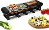 A raclette grill with food and cheese platter. Produktbild-Vorschau