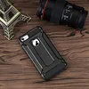 A black phone case with a silver kickstand is placed on a wooden surface next to a miniature Eiffel Tower and a camera lens. Produktbild-Vorschau