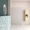 A modern bathroom with mosaic tiles, a mirror, and a wooden cabinet. Produktbild-Vorschau