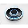 A close-up shot of a gas burner on a white stovetop with blue flames. Anteprima dell’immagine prodotto