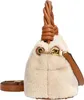 A close-up side view of a beige fuzzy handbag with brown leather accents and strap. Produktbild-Vorschau