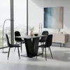 A modern dining room with a table and chairs set against a large window overlooking a city. Produktbild-Vorschau