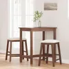 A wooden bar table with two stools in a room with a window and a painting on the wall. Náhľad obrázku produktu