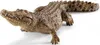A realistic toy crocodile figure is shown from a side-angle on a white background. Anteprima dell’immagine prodotto