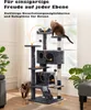 A multi-level cat tree with two cats interacting with it, set in a living room environment with a window and plants. Produktbild-Vorschau
