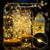 Decorative glass jars filled with warm white LED string lights, with a decorative lantern in the background. Produktbild-Vorschau