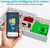 A hand holding a smartphone displaying a floor plan of a house, with a 3D model of the house in the background showing different rooms highlighted in red and green. Produktbild-Vorschau