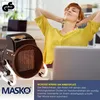 A woman relaxing at her desk with a portable heater. Produktbild-Vorschau