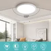 A modern living room with a round LED ceiling light. Produktbild-Vorschau