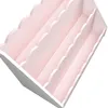 A close-up, angled view of a pink and white tiered shelf unit. Náhľad obrázku produktu