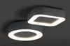 Two modern ceiling lights, one circular and one square, are shown against a dark background. Náhled obrázku produktu