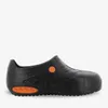 A black clog-style shoe with orange accents, shown from the side against a white background. Produktbild-Vorschau