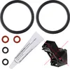 A kit of spare parts for a coffee machine, including o-rings, a large seal, and a tube of lubricant. Produktbild-Vorschau